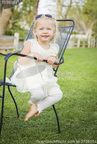Image of Cute Playful Baby Girl Portrait Outside at Park