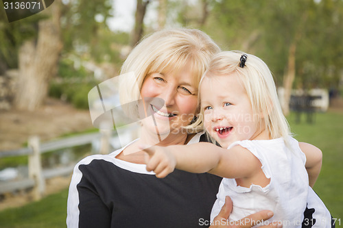 Image of Grandmother and Granddaughter Playing At The Park