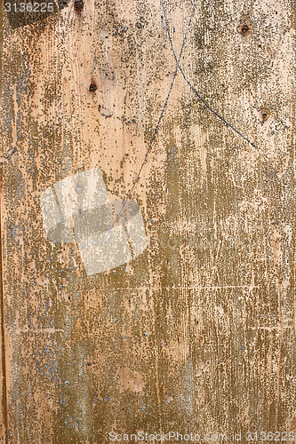 Image of weathered painted wooden board