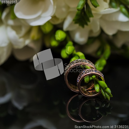 Image of Two wedding rings in infinity sign. Love concept.