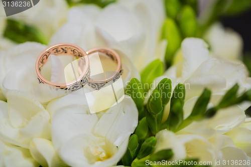 Image of Two wedding rings in infinity sign. Love concept.