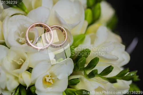 Image of Two wedding rings in infinity sign. Love concept.