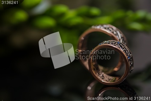 Image of Two wedding rings in infinity sign. Love concept.