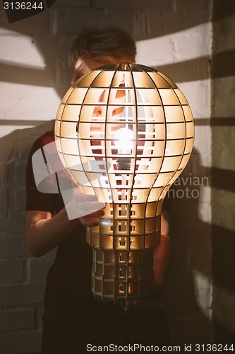 Image of Hanging, wooden light shade lamp with bulb