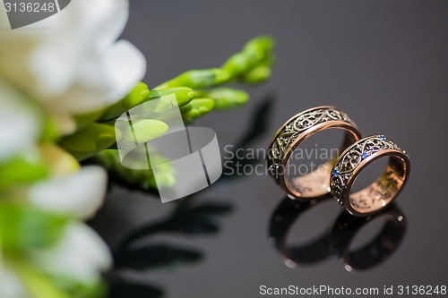 Image of Two wedding rings in infinity sign. Love concept.