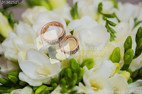 Image of Two wedding rings in infinity sign. Love concept.