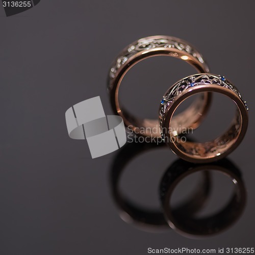 Image of Two wedding rings in infinity sign. Love concept.