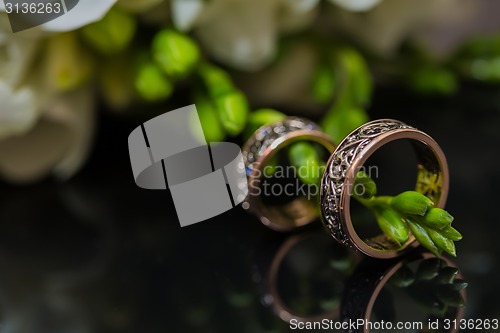 Image of Two wedding rings in infinity sign. Love concept.