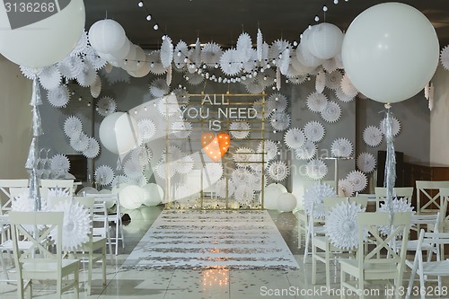 Image of wooden arch at wedding ceremony