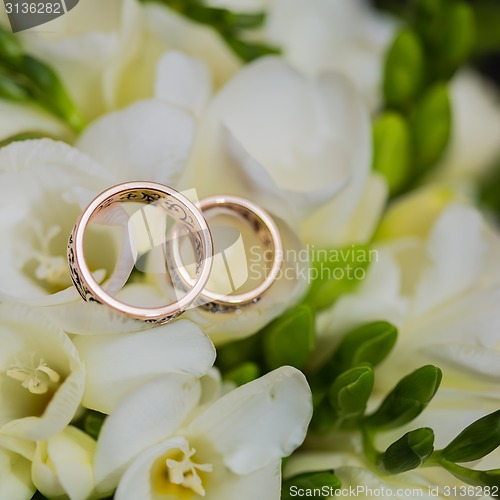 Image of Two wedding rings in infinity sign. Love concept.