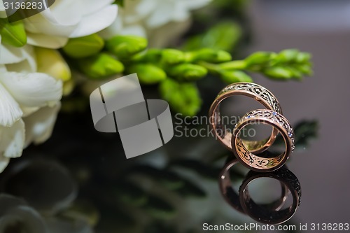 Image of Two wedding rings in infinity sign. Love concept.