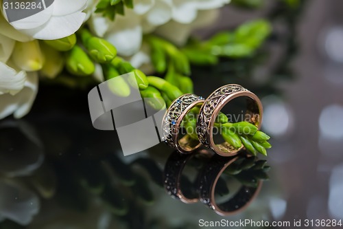 Image of Two wedding rings in infinity sign. Love concept.