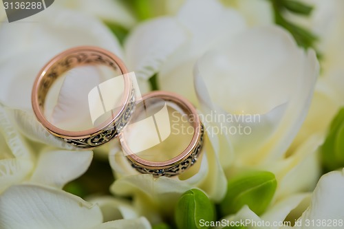 Image of Two wedding rings in infinity sign. Love concept.