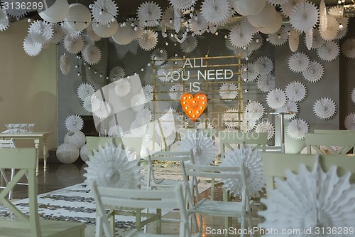 Image of wooden arch at wedding ceremony