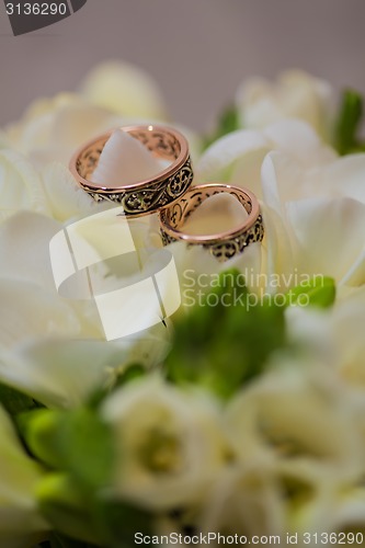 Image of Two wedding rings in infinity sign. Love concept.