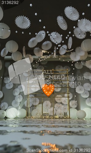 Image of wooden arch at wedding ceremony