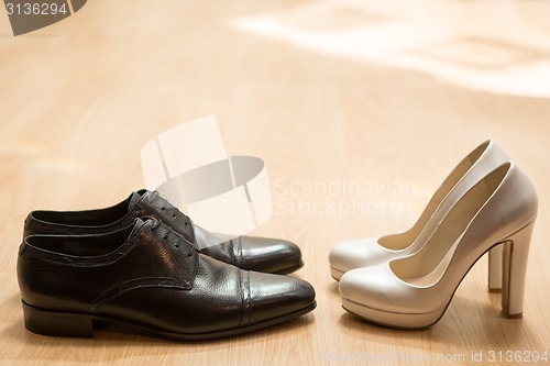 Image of Bride&#39;s and groom&#39;s shoes