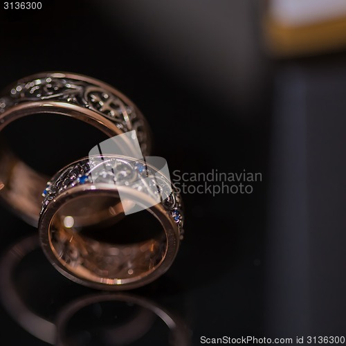 Image of Two wedding rings in infinity sign. Love concept.