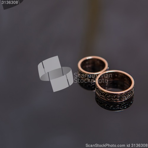 Image of Two wedding rings in infinity sign. Love concept.