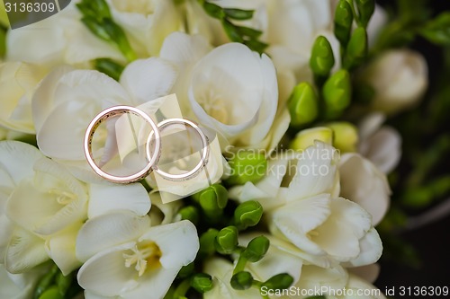 Image of Two wedding rings in infinity sign. Love concept.