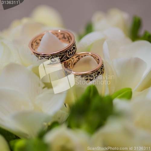 Image of Two wedding rings in infinity sign. Love concept.