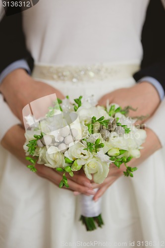 Image of Elegant bride and groom posing together