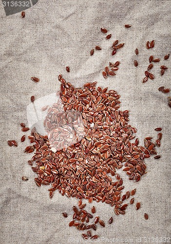 Image of natural flax seeds on linen napkin