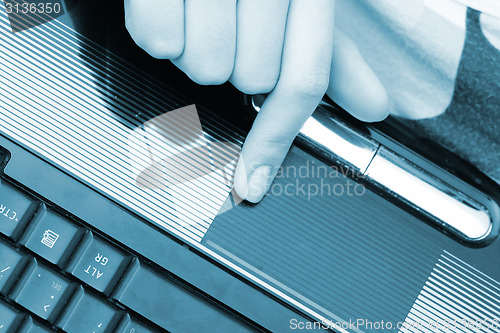 Image of Working at laptop .