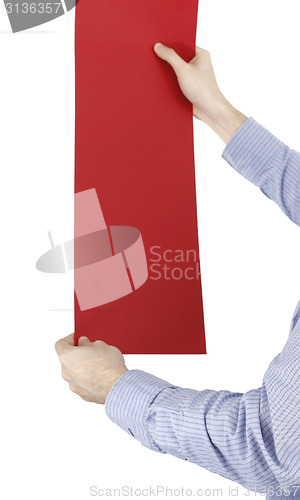 Image of Hand holdong a paper.
