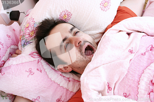 Image of Young man sleeping .