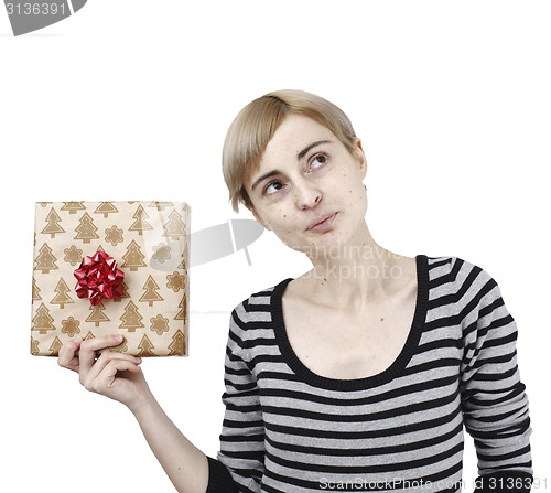 Image of Young woman holding a present