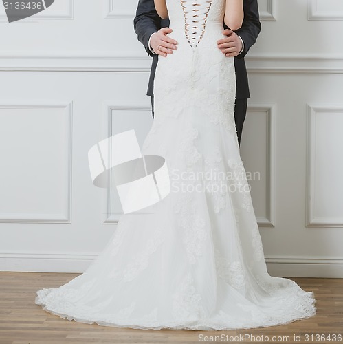 Image of Elegant bride and groom posing together