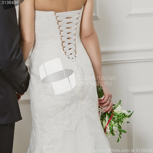 Image of Elegant bride and groom posing together