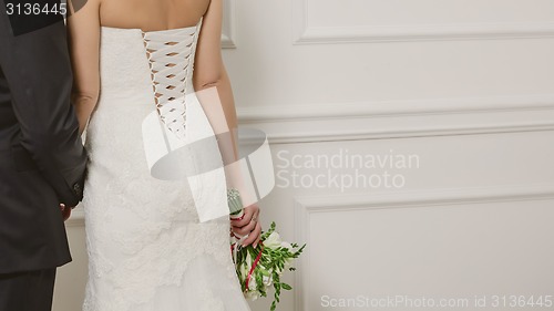 Image of Elegant bride and groom posing together