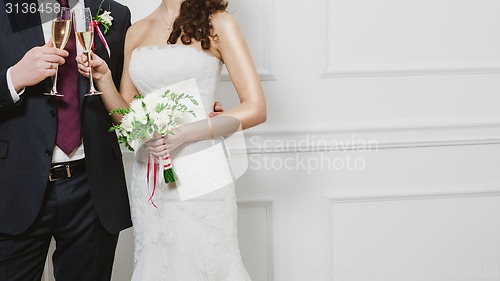 Image of Elegant bride and groom posing together