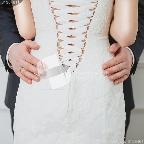 Image of Elegant bride and groom posing together