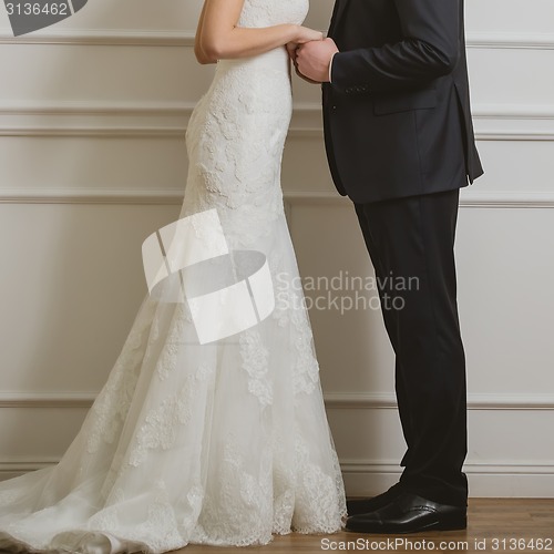 Image of Elegant bride and groom posing together