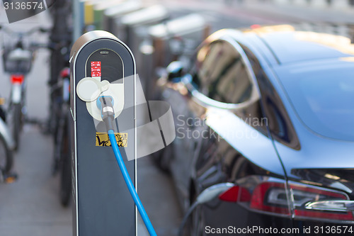 Image of Electric Car in Charging Station.