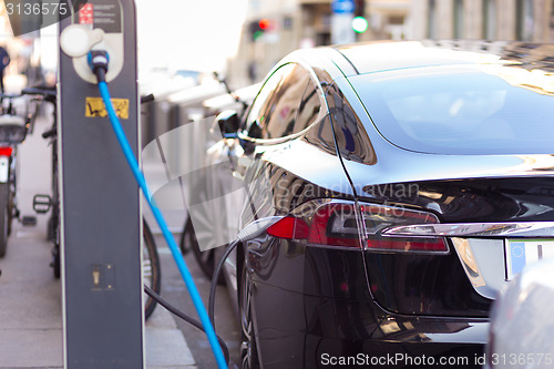 Image of Electric Car in Charging Station.