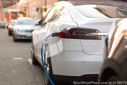 Image of Electric Car in Charging Station.