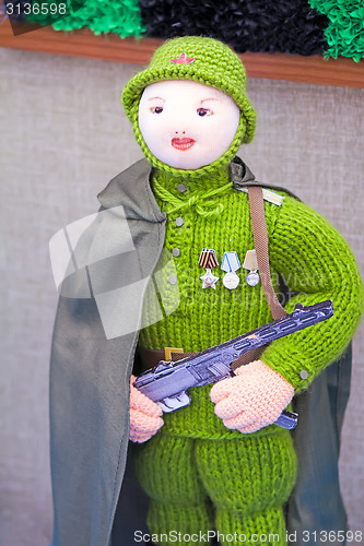 Image of Crafts: crochet figurine of a female soldier.