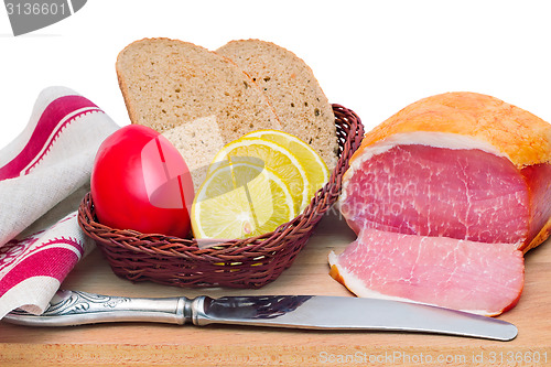 Image of Ham , bread and vegetables on a white background.
