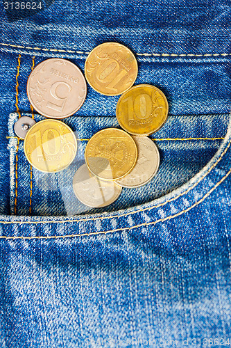 Image of Coins and pocket jeans