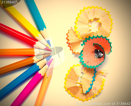 Image of several colored pencils and shavings