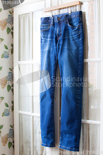 Image of jeans on hangers