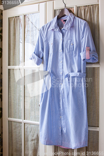 Image of cotton summer dress on a hanger