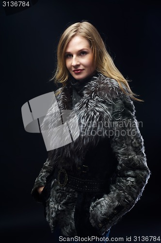 Image of Attractive woman in fur coat