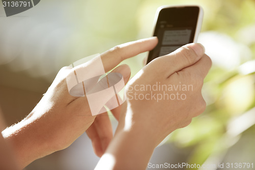 Image of Hands with smartphone