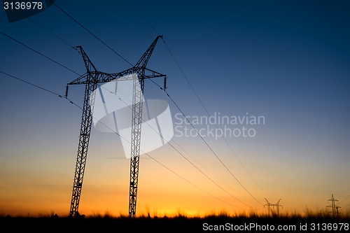 Image of Large transmission towers at blue hour 