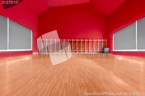 Image of Gymnasium room with red wall
